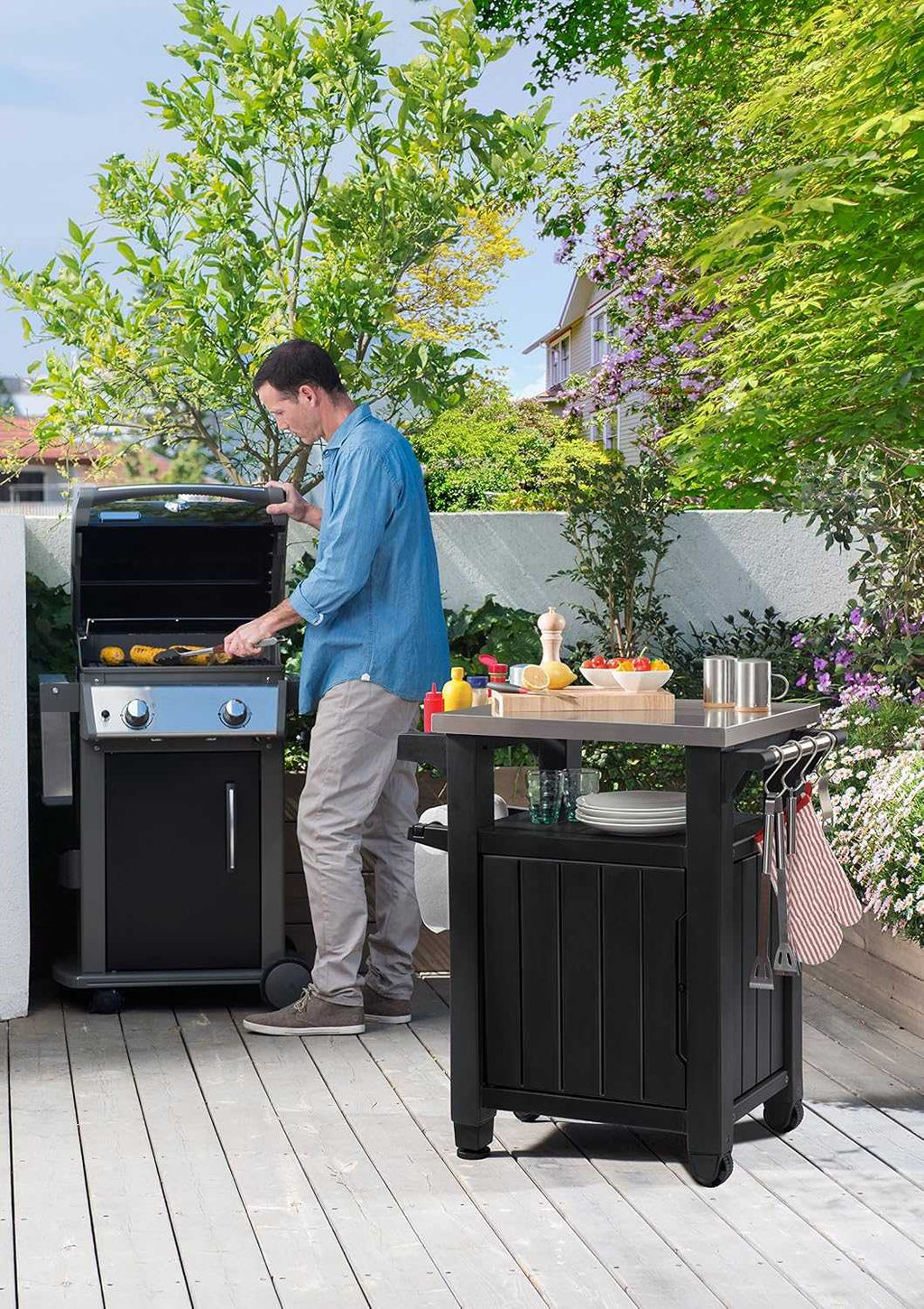 Outdoor garden kitchen food station with storage and stainless steel worktop on castors for easy mobility