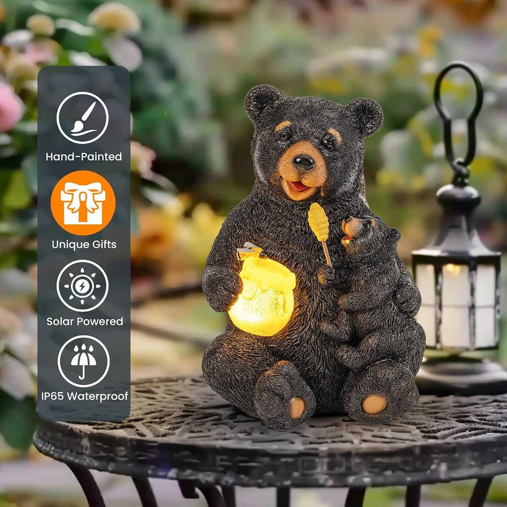 Hand-painted solar bear garden statue featuring mom and cub with soft solar-lit honey pot in outdoor setting